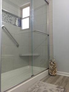 Modern bathroom with glass shower enclosure.